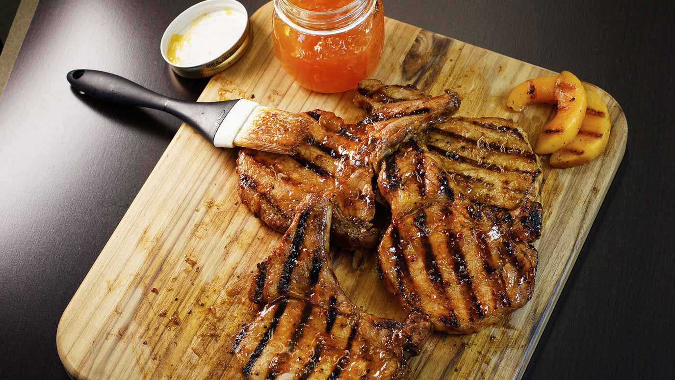 brown_sugar_bourbon_grilled_peach_pork_chops_2000x1125.jpg