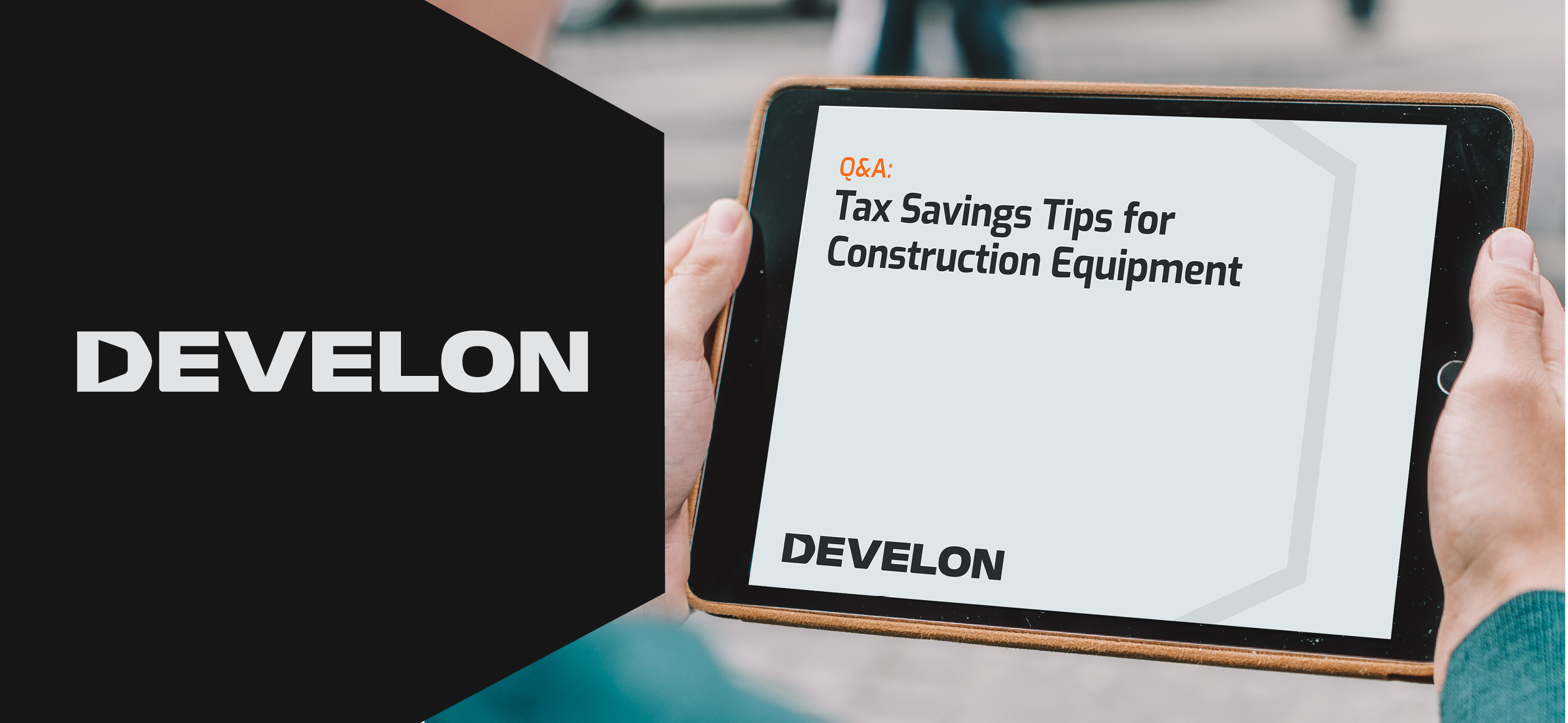 Hand holding a tablet featuring a tax savings for construction equipment white paper.