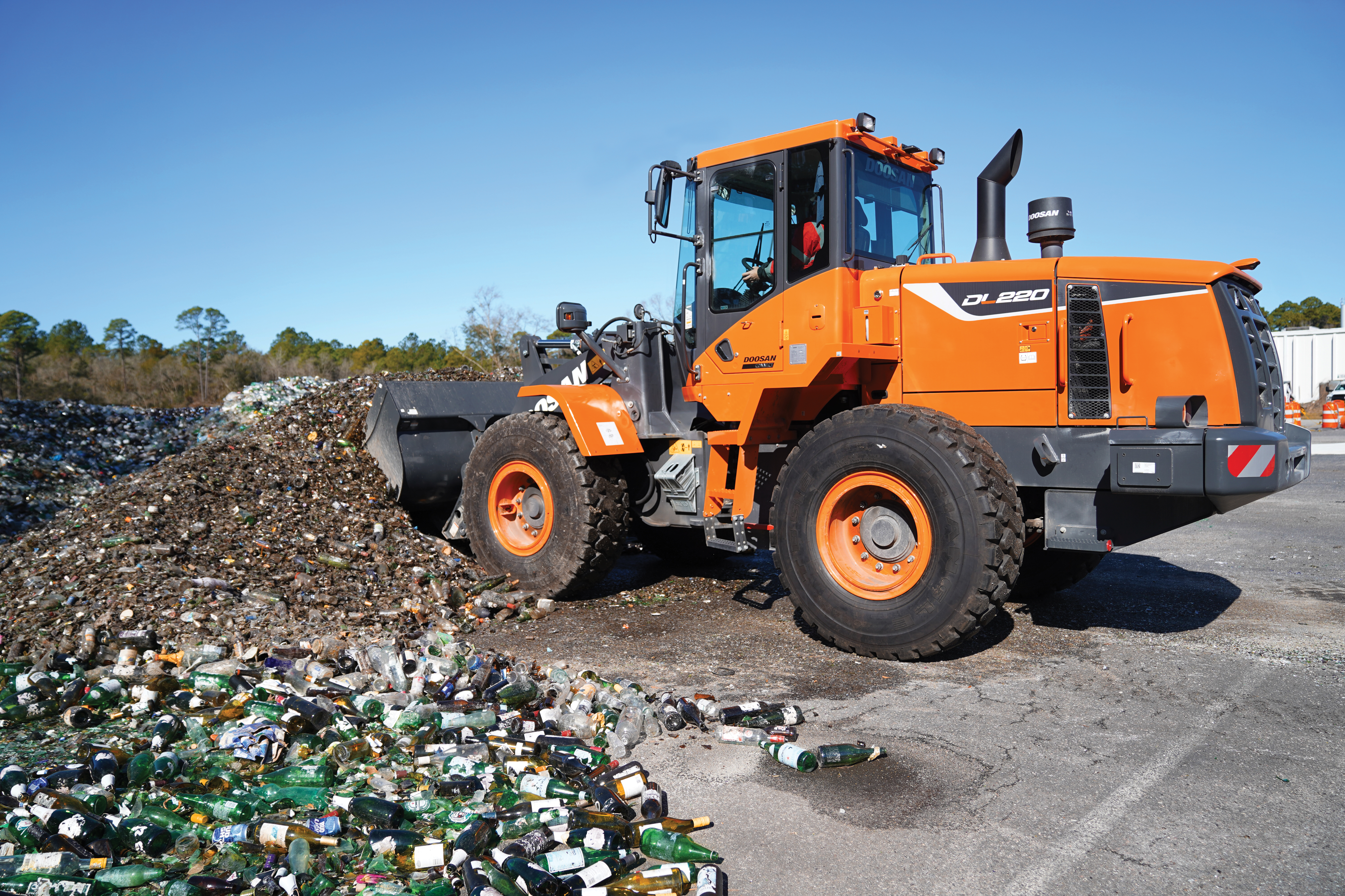 Brad Graham is the national director of site implementation at GlassWRX. He is pictured near a DEVELON wheel loader.