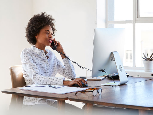 woman on desk phone